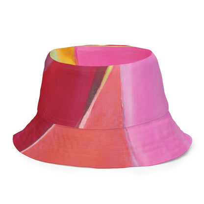 Sombrero de pescador reversible con estampado geométrico rosa, malva y rojo