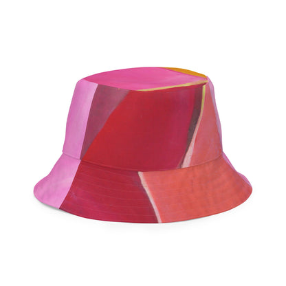 Sombrero de pescador reversible con estampado geométrico rosa, malva y rojo