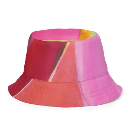 Sombrero de pescador reversible con estampado geométrico rosa, malva y rojo